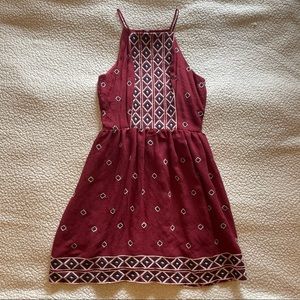 Rust red dress with geometric details